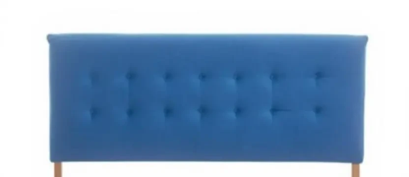 SKKS expert headboard cleaning service showing a hand using a specialized tool to deep clean a modern blue velvet and wood pattern bed headboard