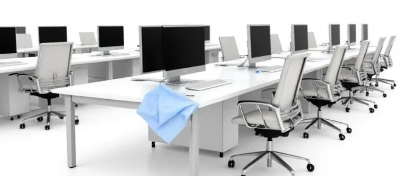SKKS premium office workstation cleaning service showing a spotless row of modern desks computers and ergonomic chairs